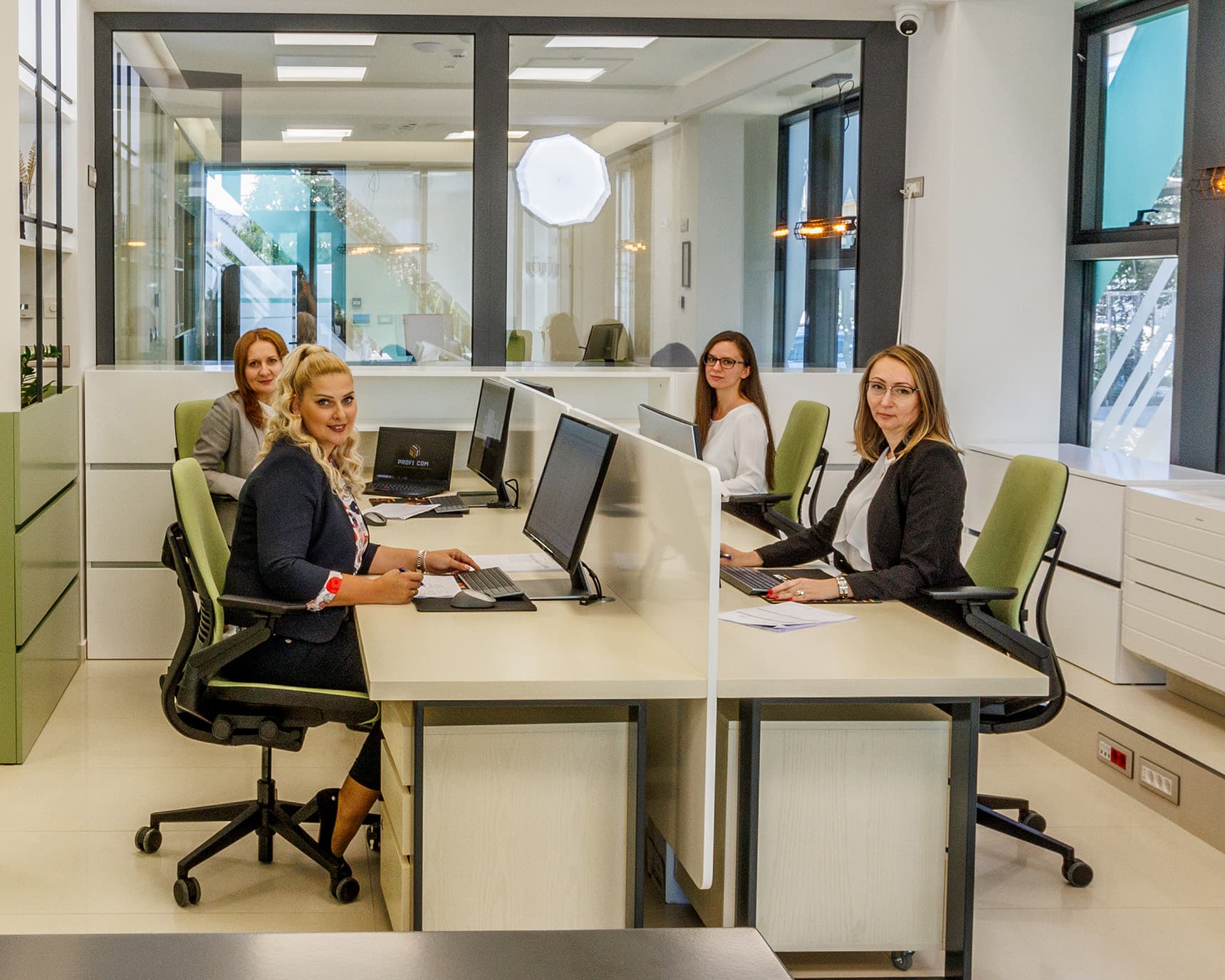 PROFI COM Agency Employees in Their Modern Office
